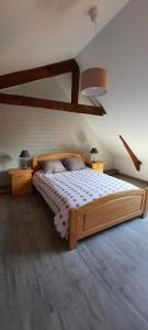 Posteľ alebo postele v izbe v ubytovaní Gîte à la ferme le vivier