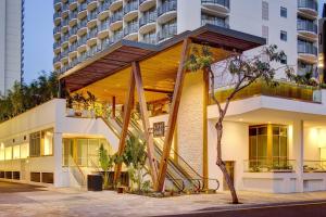 a building with a staircase on the side of it at The Laylow, Autograph Collection in Honolulu