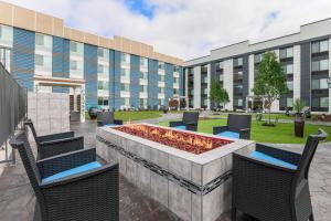 a courtyard with chairs and a fountain in front of a building at Fairfield by Marriott Inn & Suites Amarillo Central in Amarillo