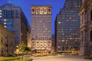 a group of tall buildings in a city at night at The Notary Hotel, Philadelphia, Autograph Collection in Philadelphia