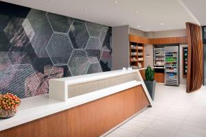 a lobby of a pharmacy with a mosaic wall at SpringHill Suites by Marriott Albuquerque North/Journal Center in Alameda