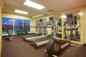 a gym with tread machines and a view of the ocean at TownePlace Suites by Marriott Corpus Christi Portland in Portland
