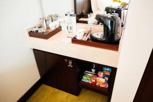 a kitchen counter with a sink and a coffee maker at Bogotá Marriott Hotel in Bogotá