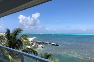 a view of the ocean from the balcony of a resort at Apartamento en Torres del Sun Rise San Andres Islas Colombia in San Andrés