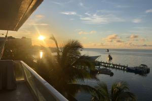 a view of the ocean at sunset from a boat at Apartamento en Torres del Sun Rise San Andres Islas Colombia in San Andrés