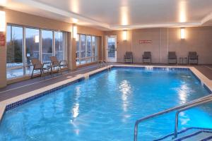 a large swimming pool in a hotel room at TownePlace Suites by Marriott Jackson in Jackson