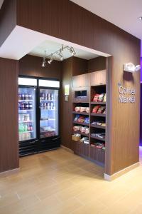 a store with a corner market refrigerator in a store at Fairfield Inn & Suites by Marriott East Grand Forks in East Grand Forks