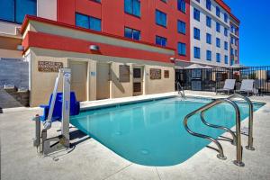 a swimming pool in front of a building at Fairfield Inn & Suites Las Vegas Airport South in Las Vegas