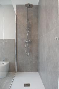 a bathroom with a shower and a sink at Ca’ del Riccio Blu in Bra