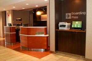 a waiting room with a laptop computer on a counter at Courtyard Chesapeake Greenbrier in Chesapeake