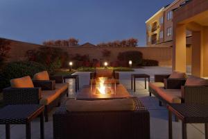 a patio with couches and a fire pit at Courtyard Chesapeake Greenbrier in Chesapeake
