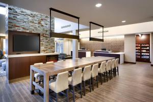 a large dining room with a large table and chairs at Residence Inn By Marriott Port Arthur in Port Arthur