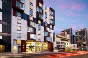 a rendering of a building on a city street at TownePlace Suites by Marriott San Diego Downtown in San Diego