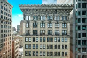 an old building in the middle of tall buildings at Element Philadelphia Downtown in Philadelphia