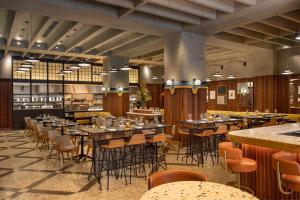 a restaurant with tables and chairs in a room at Element Philadelphia Downtown in Philadelphia