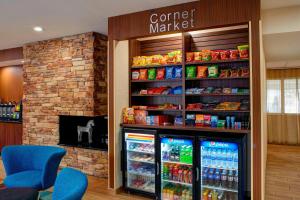 a store with a counter with a refrigerator at Fairfield Inn & Suites Detroit Farmington Hills in Farmington Hills