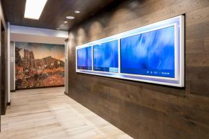 a large flat screen tv on a wall at SpringHill Suites by Marriott Truckee in Truckee