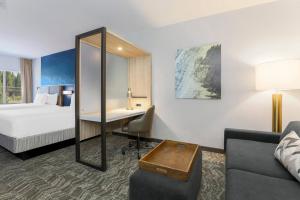 a hotel room with a bed and a desk at SpringHill Suites by Marriott Truckee in Truckee