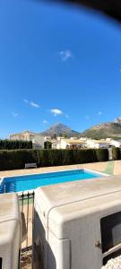 a view of a swimming pool from a house at Velo Villa w/ A/C, free Wi-Fi & Pool near Benidorm in Polop