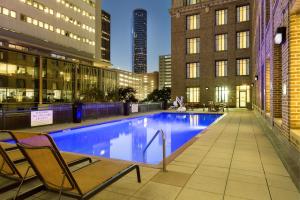 a swimming pool on the rooftop of a building at SpringHill Suites by Marriott Houston Downtown/Convention Center in Houston