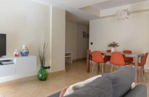 a living room with a couch and a table at relax apartment inn in Catania