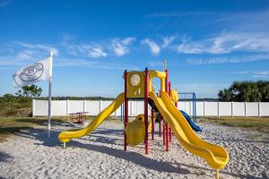 a playground with a slide in the sand at Pinnacle Port PH22 in Panama City