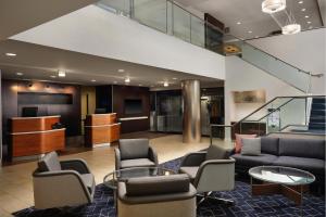 a lobby with couches and chairs in a building at Courtyard Los Angeles Century City/Beverly Hills in Los Angeles