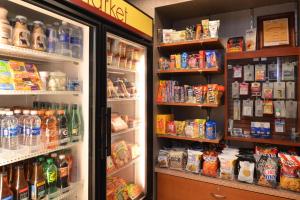 a refrigerator in a store filled with lots of food at SpringHill Suites Pittsburgh Mills in Tarentum