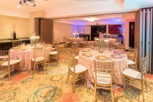 a banquet room with tables and chairs with candles at Residence Inn by Marriott San Jose Escazu in San José