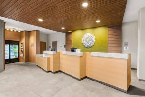 a lobby with a reception desk in a building at Fairfield Inn & Suites by Marriott Seattle Downtown/Seattle Center in Seattle