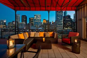 a rooftop patio with a view of a city skyline at Hotel ICON, Autograph Collection in Houston
