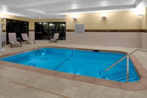 a large swimming pool in a hotel room at Courtyard by Marriott Dallas Flower Mound in Flower Mound