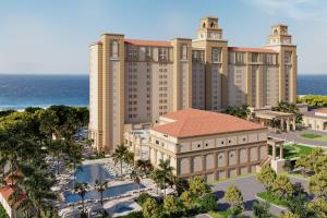 un artista representando el gran hotel y casino Mgm en The Ritz-Carlton Naples en Naples