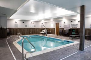 a large swimming pool in a hotel room at Fairfield Inn & Suites by Marriott Richmond Airport in Sandston