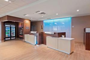 a lobby of a store with a large glass wall at Fairfield Inn & Suites by Marriott St Petersburg North in St Petersburg