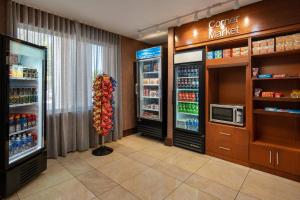 a store with two refrigerators and a coffee maker at Fairfield Inn & Suites by Marriott Visalia Tulare in Tulare