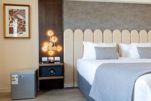 En eller flere senger på et rom på Hotel HW High Wellness