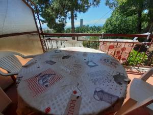 a table sitting on a deck with at Casetta Appennina (Bike Host) in Montefalcone Appennino