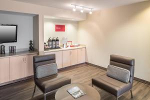 a waiting room with two chairs and a table at TownePlace Suites by Marriott Panama City in Panama City