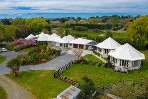 an aerial view of a row of white houses at Silverstream Alpaca Farmstay & Tour in Kaiapoi