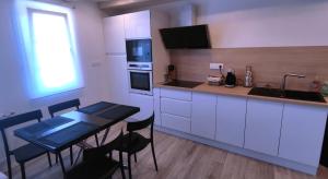 Kuchyň nebo kuchyňský kout v ubytování Sweet Home