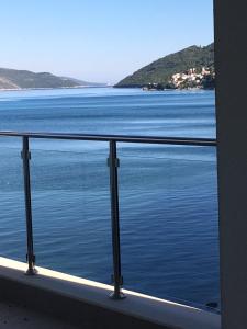 a view of the water from a balcony at Hotel Vienna in Herceg-Novi