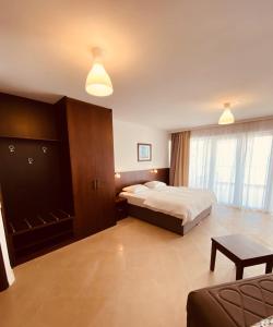 Postel nebo postele na pokoji v ubytování Hotel Vienna