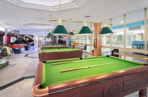 a row of pool tables in a billiard room at EL ESTUDIO DE LA PLAYA BENALBEACH 804 Holidays Paradise in Benalmádena