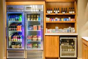 a refrigerator with its door open in a kitchen at SpringHill Suites Houston NASA/Seabrook in Seabrook