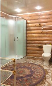 a bathroom with a glass shower and a toilet at Beautiful Villa For Family/Couples in Molėtai