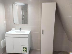 a white bathroom with a sink and a mirror at Aveiro Ria House E in Aveiro +24 photos