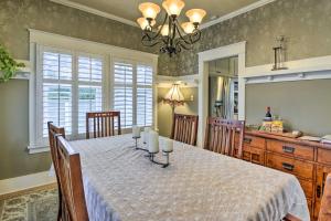 a dining room with a table with candles on it at Serene Tacoma Home with Furnished Deck and Views! in Tacoma