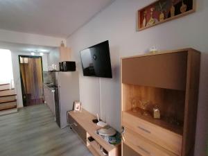 A television and/or entertainment centre at Castillo Mar- Casa Martini