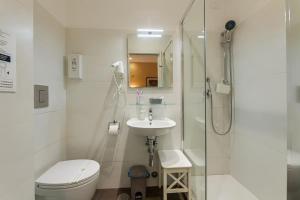 a bathroom with a shower and a toilet and a sink at St. Peter's Relax in Rome